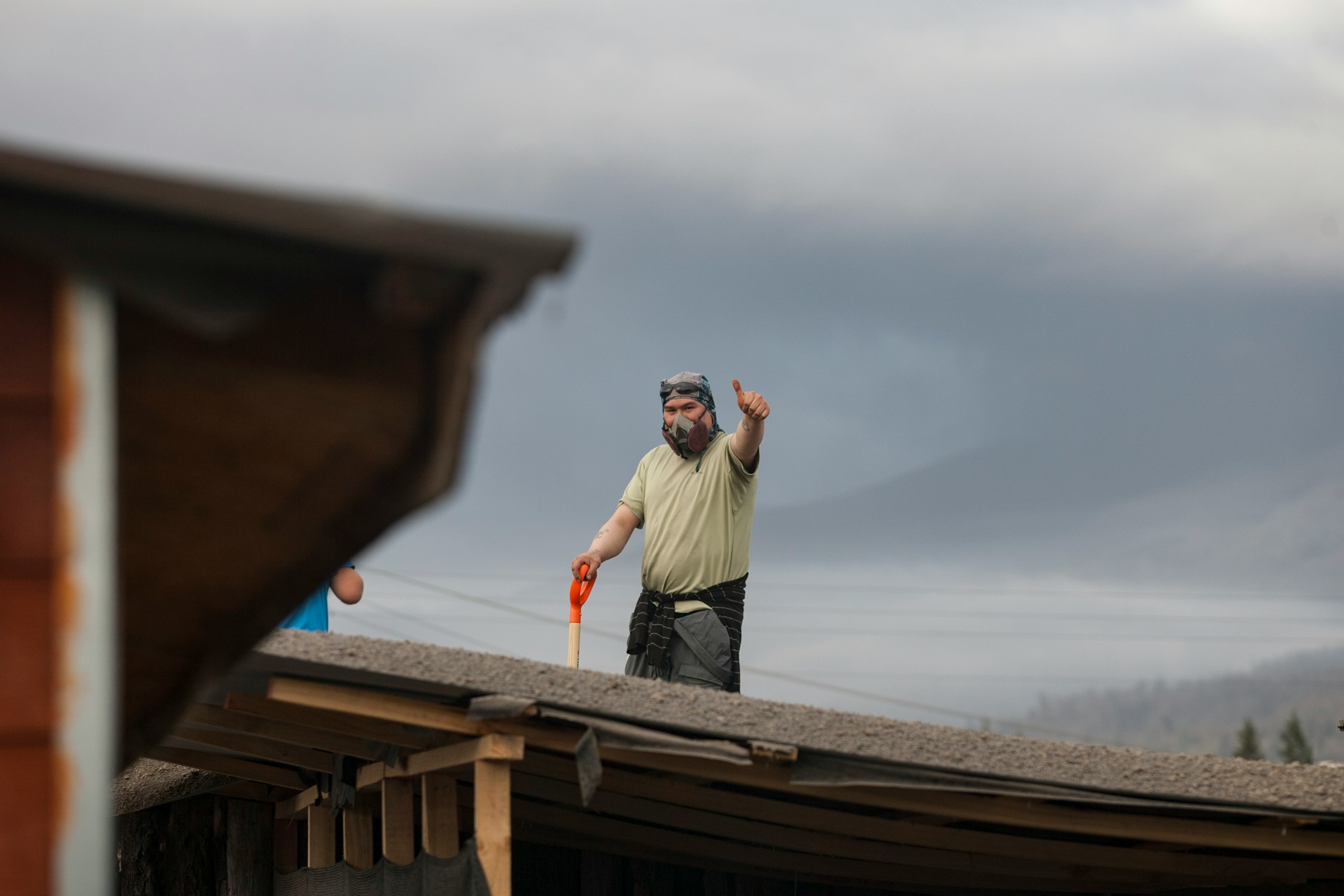 Crew member on a damaged roof