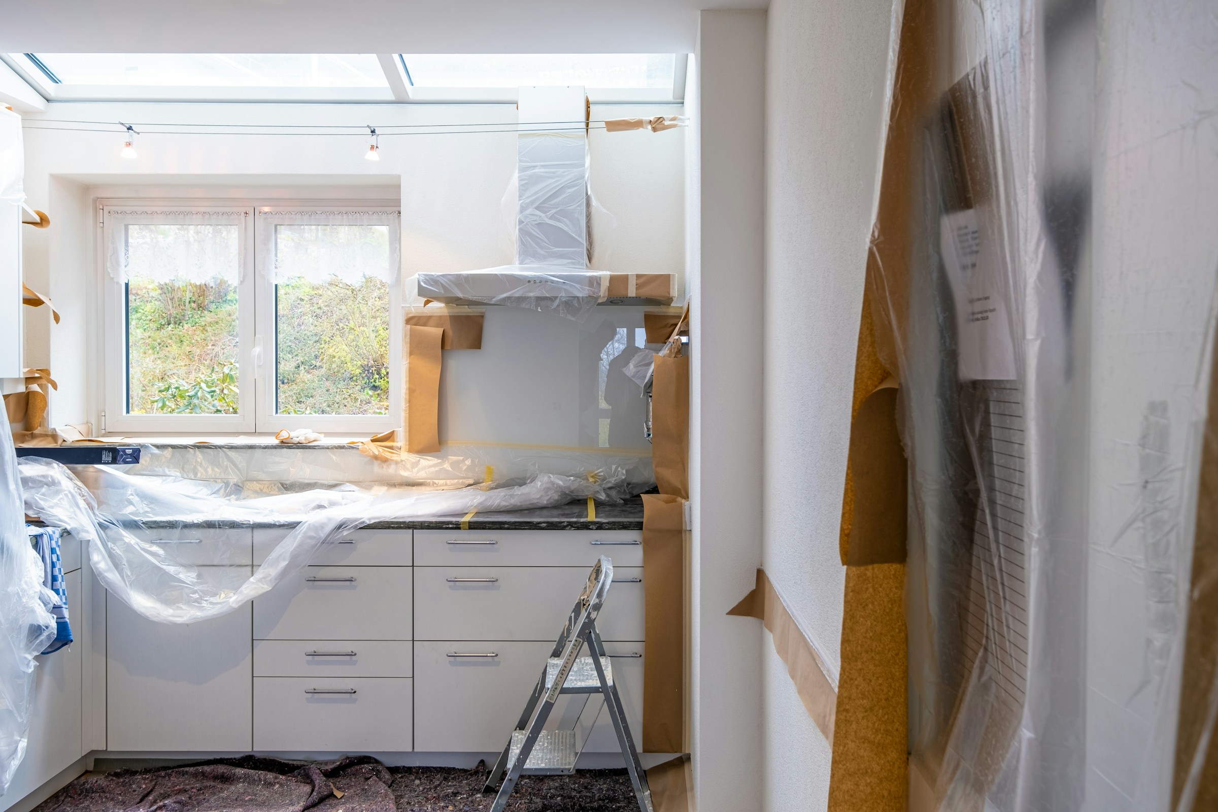 Crew restoring a water-damaged kitchen